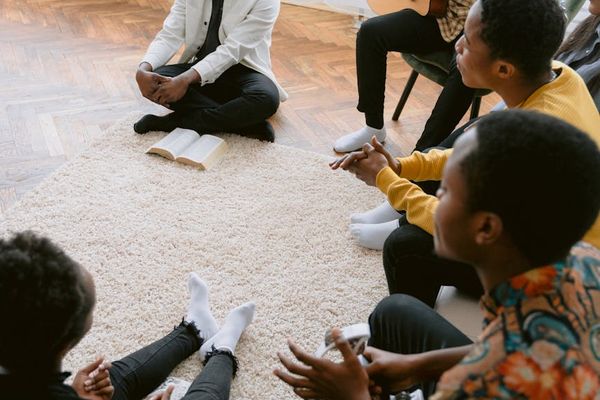 Group of diverse people sitting in a circle for a class